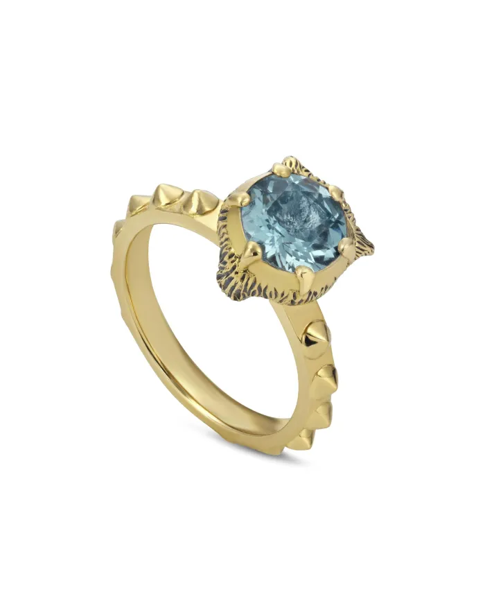 Bague Gucci Le Marché des Merveilles en or jaune, ornée d'aigue-marine et de diamants, avec tête de félin.