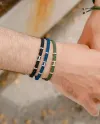 Concordia Jewellery Wish Bracelet with Red Cord and Yellow Gold and Ruby Elements