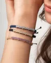 Bracelet exclusif Concordia Jewellery, cordon noir avec élément en or jaune et diamants