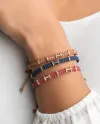 Bracelet Concordia Jewellery Bridge avec cordon gris et éléments en or rose sertis de diamants