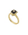 Bague Gucci Le Marché des Merveilles en or jaune, ornée d'onyx noir et de diamants, représentant une tête de félin.