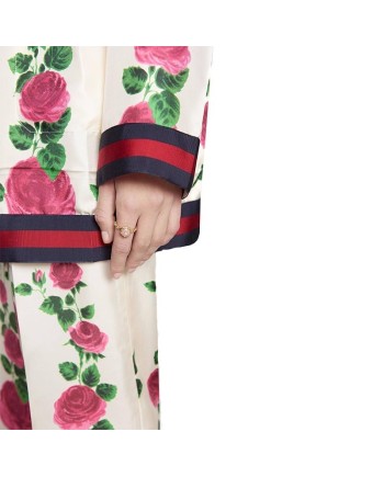 Bague Gucci Le Marché des Merveilles en or jaune, ornée d'une opale rose et de diamants, représentant une tête de félin.