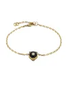 Bracelet Gucci Le Marché des Merveilles en or jaune, onyx noir et diamants, orné d'une tête de félin.